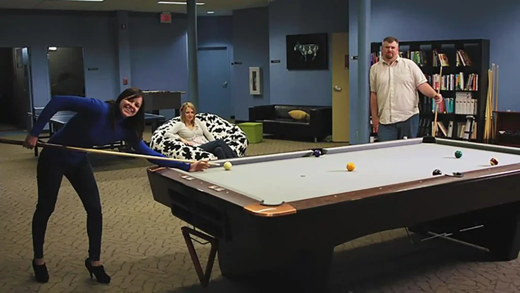 Troy playing pool with coworkers at Fatwallet